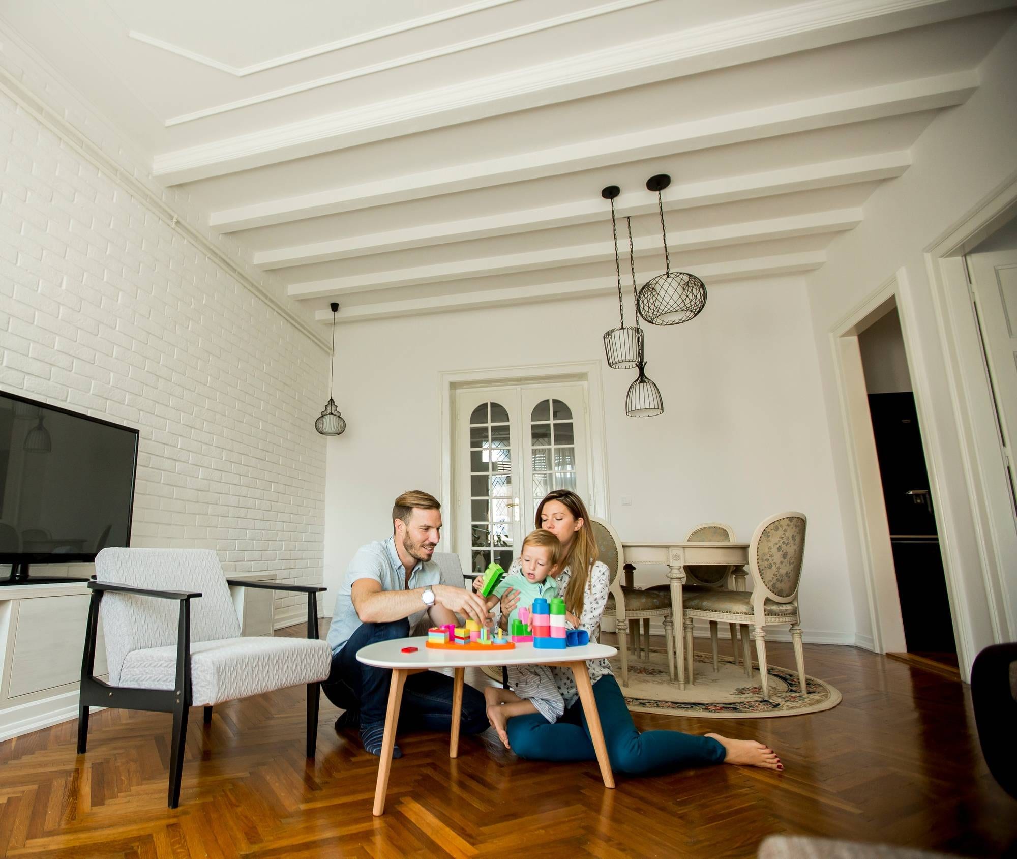 Happy family playing in the living room