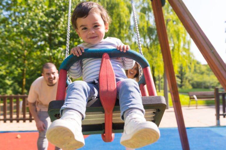 Supervised visitation rules for parents - parent and child at playground during supervised visit