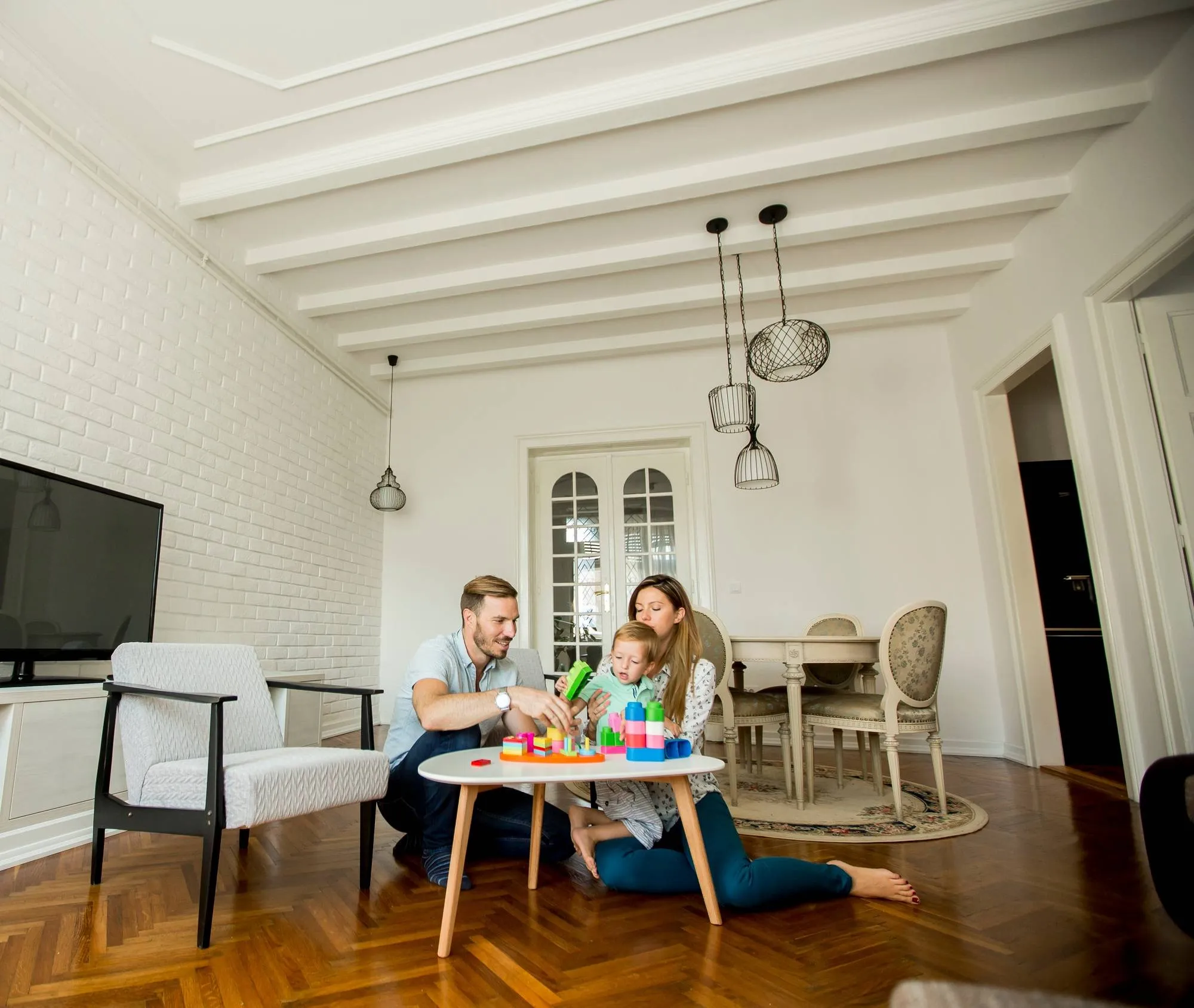 Happy family playing in the living room